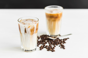 Delicious drink concept - Iced coffee in a glass with ice.