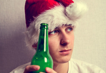 Sad Young Man in Santa Hat