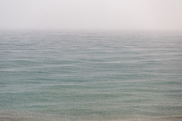 Obraz premium Sea surface on a rainy day as a background or backdrop