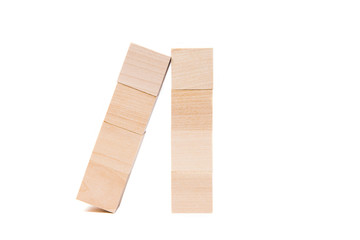 Light yellow wooden cubes on white background. Isolated on white. Business, finance, education