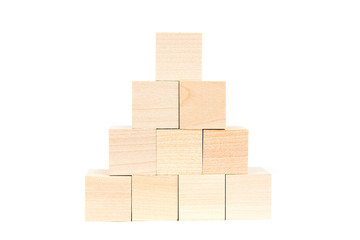 Light yellow wooden cubes on white background. Isolated on white. Business, finance, education