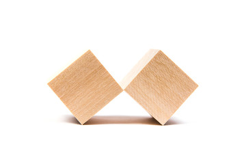 Light yellow wooden cubes on white background. Isolated on white. Business, finance, education
