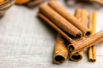 cinnamon sticks on wood space
