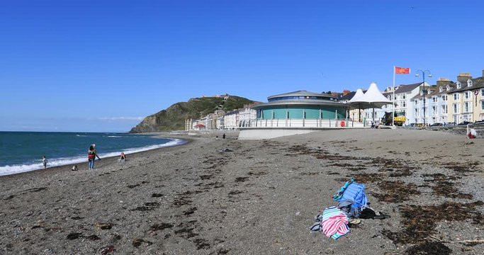 Aberystwyth Wales family beach pavilion Irish. Ancient market town, administrative center, community, and holiday resort in Ceredigion, Wales. Tourist destination for beach, historic train, castles.