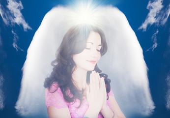 Beautiful young girl praying, protected by a guardian abstract angel