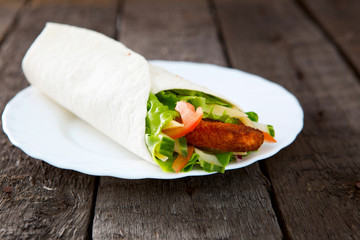 Fresh juicy tortilla wrap with chicken and vegetables