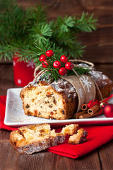 Fototapeta na wymiar Stollen, traditional Christmas cake with dried fruits and nuts. Christmas holiday food 