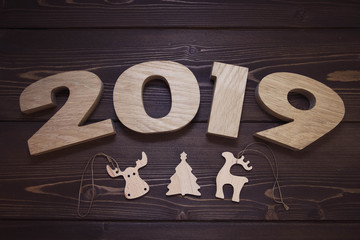 New year 2019 on dark wooden background