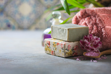 The concept spa. Handmade soap, towels, flowers and sea salt.