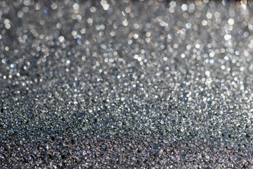 Shiny silver abstract background with bokeh