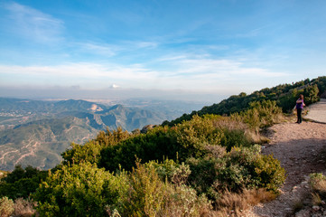 Hiker enjoying the view from Montserrat