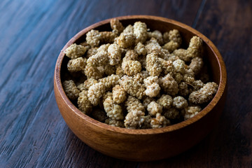 Sun Dried Mulberries in Wooden Bowl.