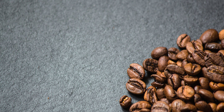 coffee beans (good and bad grain) - arabica and robusta blend (roasted coffee grain). Black background. Top view . Copy space.