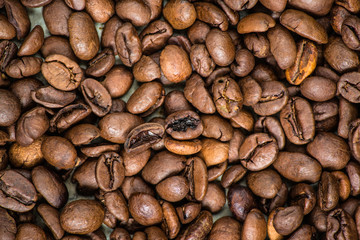 coffee beans (good and bad grain) - arabica and robusta blend (roasted coffee grain). Black background. Top view . Copy space.