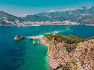 Fototapeta premium aerial view. people resting at seaside. sunbathing at sun loungers. summer vacation