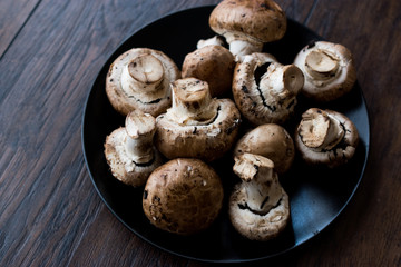 Portobello Raw Cremini Mushrooms in Black Plate.