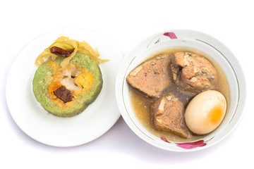 Vietnamese sticky rice with pork and egg Banh tet. They are rice and minced bean mix with boiled pork and egg, then wrapped in banana leaves, and cooked in hot water. You can eat along with cabbage or
