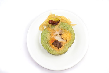 Vietnamese sticky rice with pork and egg Banh tet. They are rice and minced bean mix with boiled pork and egg, then wrapped in banana leaves, and cooked in hot water. You can eat along with cabbage or