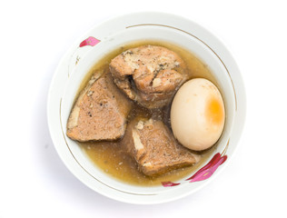 This dish is called Pork and Egg Stew or Caramelized Pork and Eggs (Thit Kho Trung). It is usually served with steamed rice and cooked vegetable or pickled vegetable. It is made of fresh coconut water
