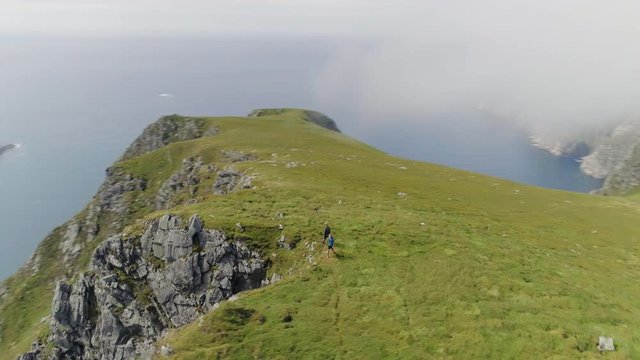 Two Friends on Top of Hoddevik Mountain
