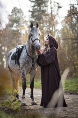 Obraz premium Young woman with a horse