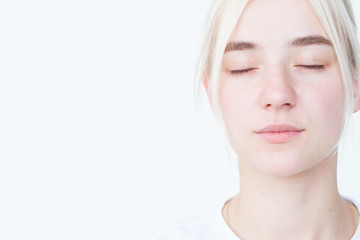 Naklejka premium pensive thoughtful mysterious beautiful woman with eyes closed. portrait on white background.