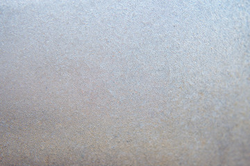 Winter background, frozen glass from strong frost, ice texture on the window