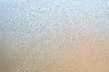 Fototapeta premium Winter background, frozen glass from strong frost, ice texture on the window