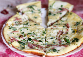 tasty magnificent omelet with greens and sausage