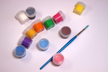 Colorful paints and brush