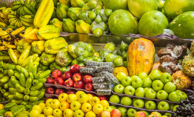 colorful photograph of well-to-do fruits in a Latino market