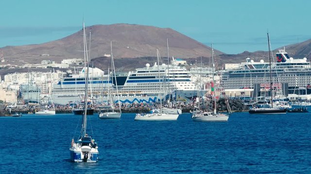 sailing boats are leaving the city marina for the atlantic crossing regatta race ARC 2018 on a sunny day