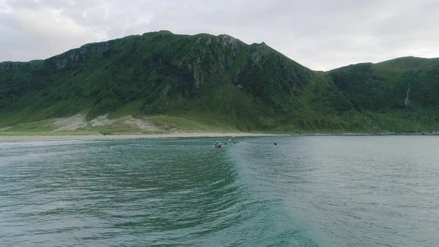 A Panoramic View of Surf Waves and the Mountain in Hoddevik, Norway