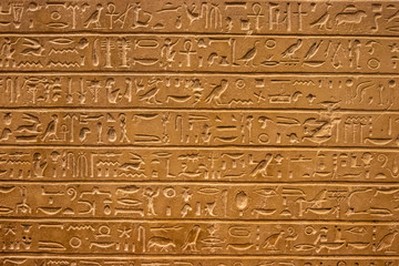 Old egypt hieroglyphs carved on the stone.