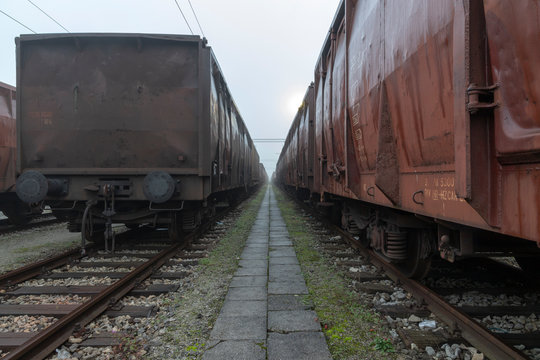 Old train wagons parked in a train station