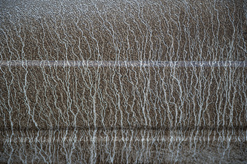 background texture drips dirt on a grooved white surface