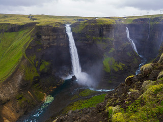 Fototapeta na wymiar Valley of river Fossa with Beautiful Haifoss waterfall in South Iceland, summer moody sky