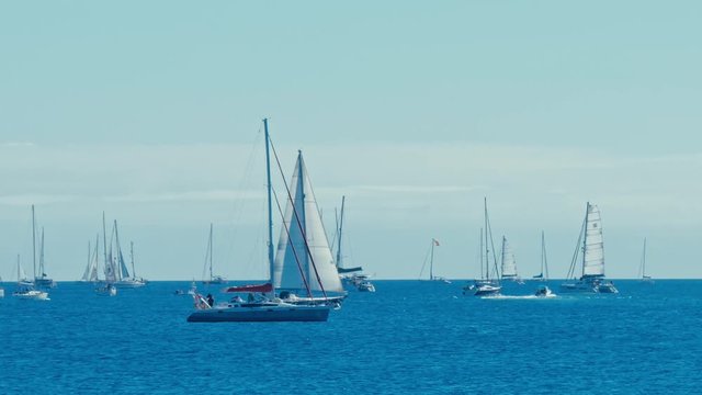 sailing boats are leaving the city marina for the atlantic crossing regatta race ARC 2018 on a sunny day
