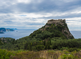Fototapeta na wymiar Aerial view of iconic medieval fortified castle of Angelokastro with amazing views, known as Angel Castle close to Paleokastritsa, summer cloudy day, Corfu Greece