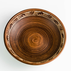 pots and plates of clay on a white table and a blue background. clay pottery kitchen utensils made by hand. red clay tableware