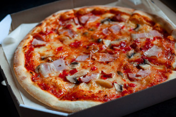 Pizza in cardboard box