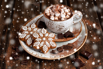 Hot cocoa with marshmallows and gingerbread cookies on the wooden background. Christmas concept