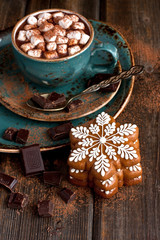 Hot cocoa with marshmallows and gingerbread cookies on the wooden background. Christmas concept