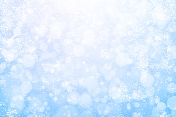 Abstract winter background with snowfall in bokeh