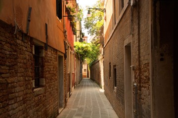 Small picturesque street of Venice without tourists. Italy.