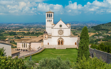 Fototapeta premium Saint Francis Basilica in Assisi on a sunny summer day. Umbria, central Italy.