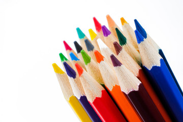 Color pencils close up on white background. The concept of drawing tools.
