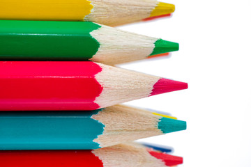 Color pencils close up on white background. The concept of drawing tools.
