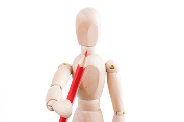 The concept of human artist. Wooden man hold red pencil on a white background.