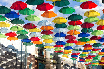 Fototapeta na wymiar Installation of hanging colored umbrellas